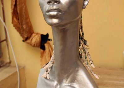 1 Title- Mannequin Series F Artist-Taiye Idahor. Year- 2011, Meduim- Fibre glass, newspaper